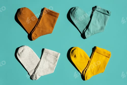 Preview: Some Socks on Turquoise Background. Layout Colourful Socks.