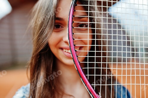 Preview: Young sporty girl player with tennis racket