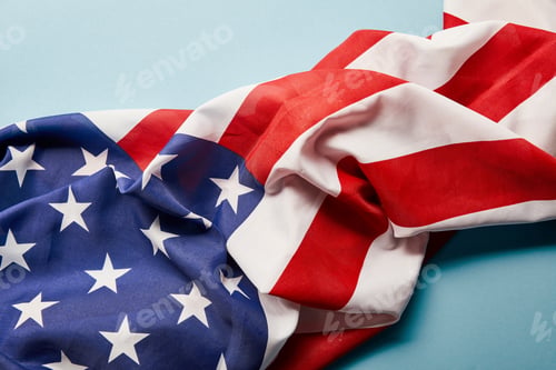 Preview: close up view of american flag on blue background