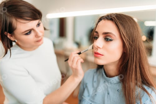 Preview: Female make up artist work with woman face