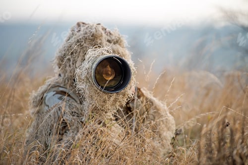 Preview: Wildlife photographer in the ghillie suit working