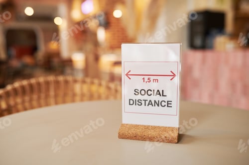 Preview: Social Distance Sign On Cafe Table