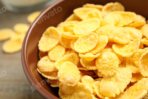Preview: Tasty crispy corn flakes in bowl, closeup