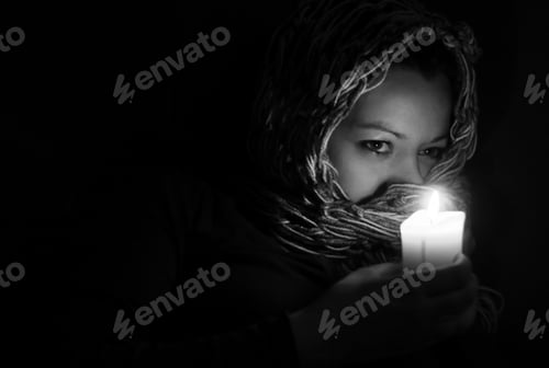 Preview: Woman holding a candle