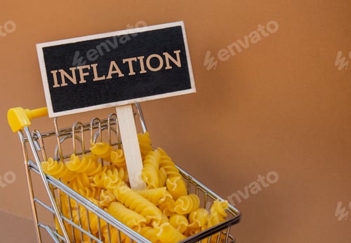 Preview: INFLATION text on Blackboard label against Shopping trolley cart Filled With Pasta on Beige