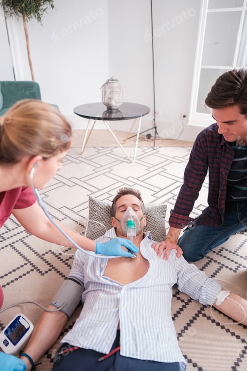 Preview: Young doctor trying to stabilize a patient who has suffered an emergency. Concept: emergency, rescue