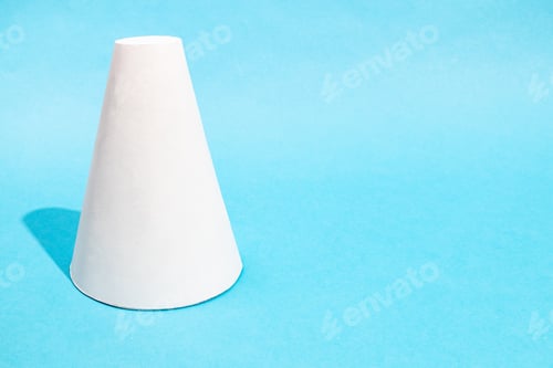 Preview: single hand-crafted paper frustum cone on blue