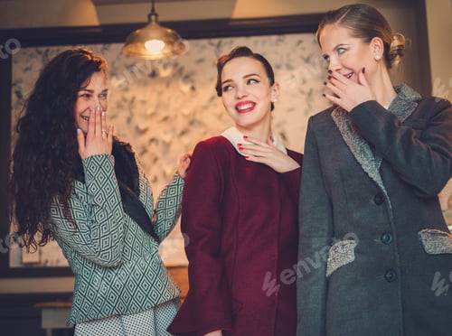 Preview: Three elegant young ladies ready for a party