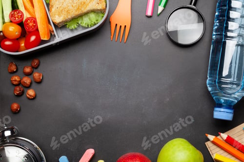 Preview: School lunch box and education stationery on stone table