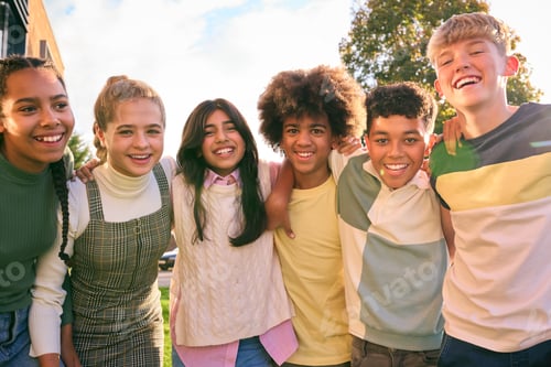Preview: Portrait Showing Class Of Secondary Or High School Pupils Standing Outside School Building Hugging