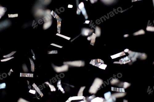 Preview: silver confetti over black background