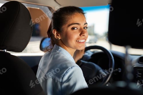 Preview: Smiling Young Woman in Car
