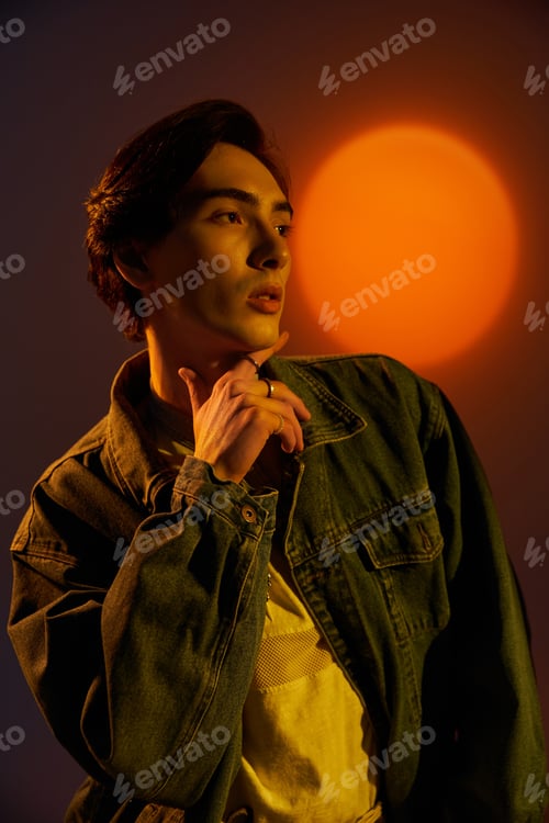 Preview: Young non-binary individual embodies style in vibrant sunset lighting