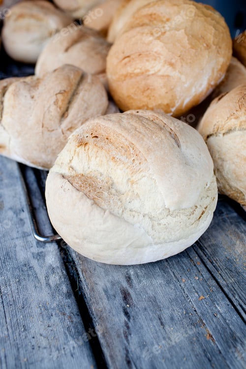 Preview: Fresh bread rolls on top of picnic bench, South Tyrol, Italy