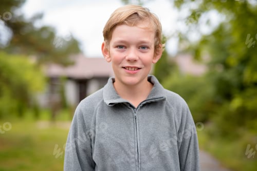 Preview: Young Happy Handsome Boy Smiling At Home Outdoors