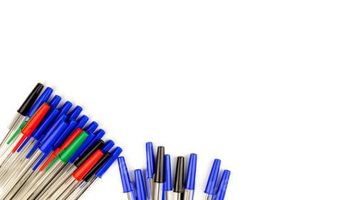 Preview: Pile of a lot multi colored plastic ballpoint pens isolated on white background.