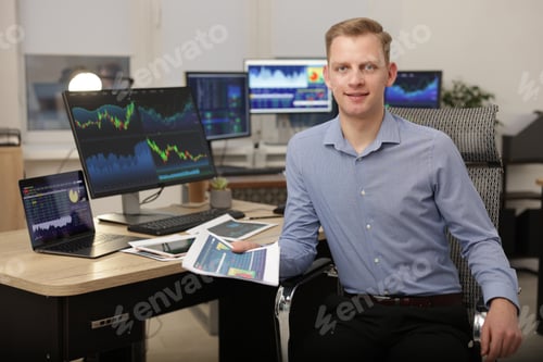 Preview: Stock exchange. Man working at desk in office
