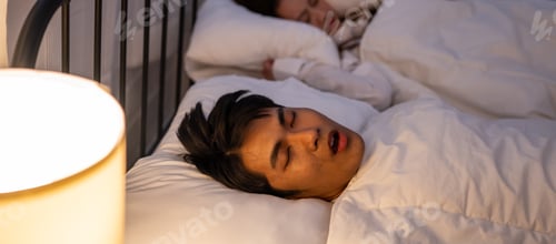 Preview: Asian woman feel frustrated from husband snoring while sleep at night.