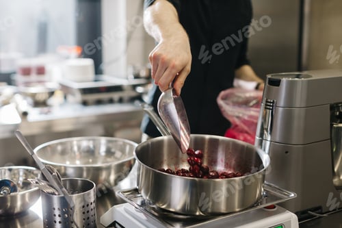 Preview: Close up. A chef weighs cherries for baking a fruit pie or other desserts.