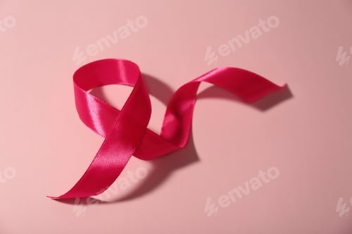 Preview: Pink ribbon on color background. Breast cancer awareness concept