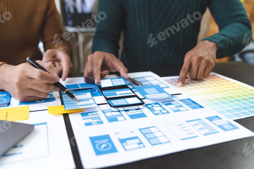 Preview: A group of Asian UI developers, designers, and data researchers are brainstorming their projects wit
