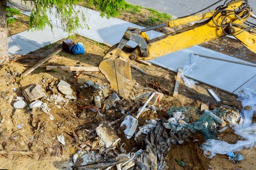Preview: Backhoe working on garbage dump in soil pollution construction site