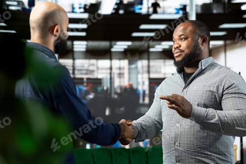 Preview: Man talking to director to explain startup evolution vision, doing handshake