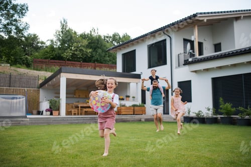 Preview: Father with three daughters playing outdoors in the backyard, running