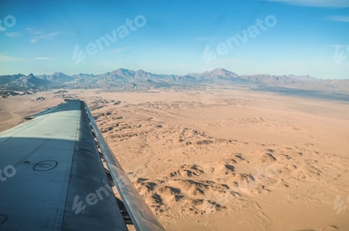 Preview: Airplane wing on the background of the Sahara