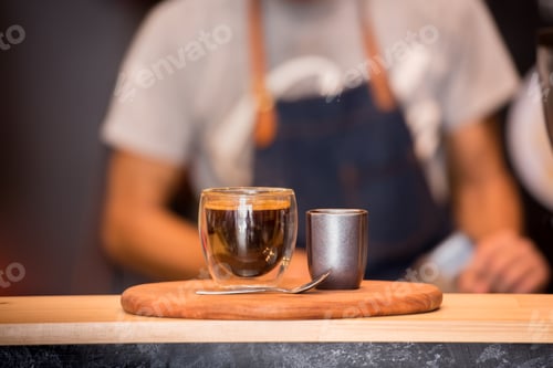 Preview: Black Coffee Cup On Wooden Table And Coffee Barista