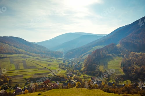 Preview: Lush green mountainous countryside on a misty day