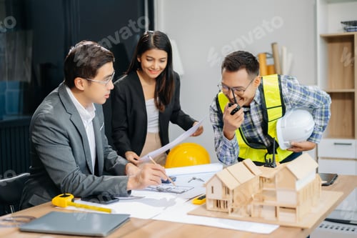 Preview: Engineer teams meeting working together wear worker helmets hardhat with on architectural project