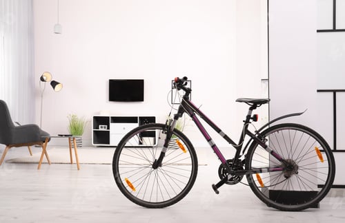 Preview: Light living room interior with modern bicycle