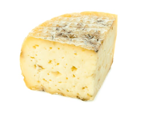 Preview: Tasty block of artisanal cheese showcasing its unique texture and artisanal craftsmanship