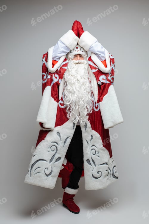 Preview: Father Frost posing with arms up in namaste gesture.