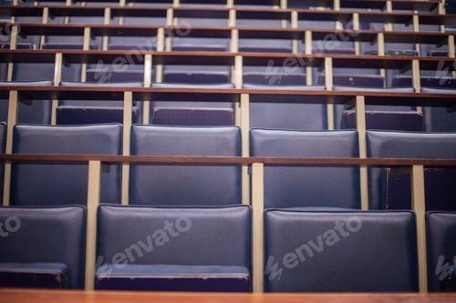 Preview: Row of empty seats in auditorium