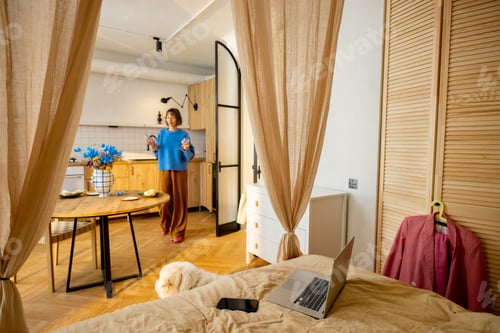 Preview: Woman in stylish studio apartment