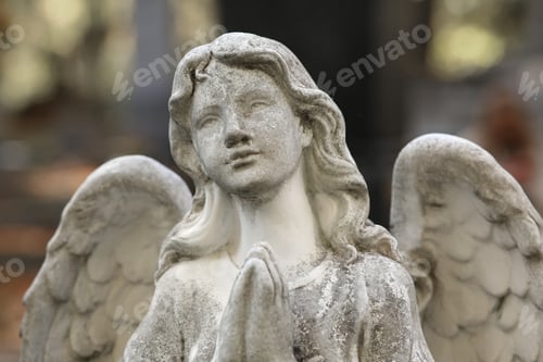 Preview: Beautiful statue of angel at cemetery, closeup. Religious symbol