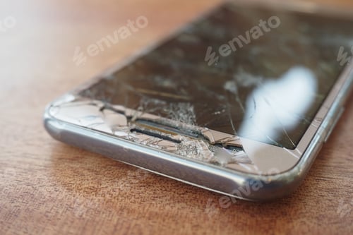 Preview: Top view of broken smart phone on color background