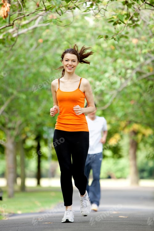 Preview: Fit Woman Jogging Outdoors At The Park