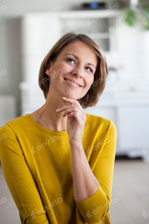 Preview: Portrait of smiling woman looking up