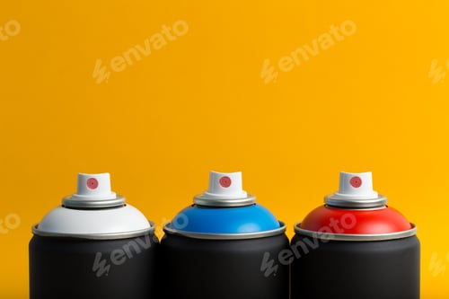 Preview: Colorful spray paint cans arranged on a bright yellow background in creative display