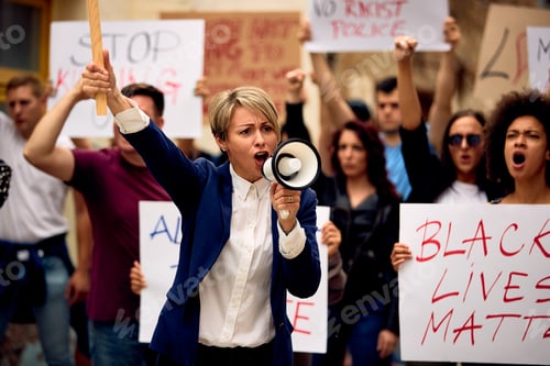 Preview: Woman shouting through megaphone while marching on black lives matter protest.
