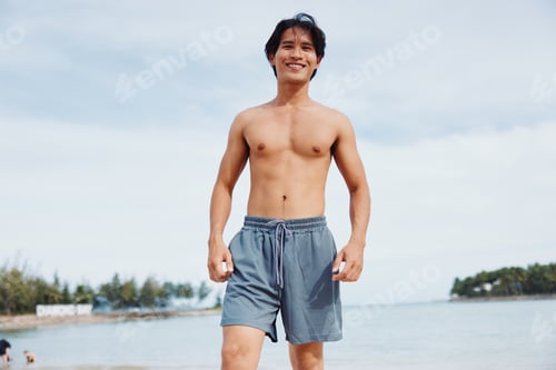 Preview: Muscular Asian Athlete Enjoying Beach Running: Fitness and Freedom