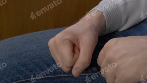 Preview: Man clenched fist. Man clenches his fist when his chastises the chief