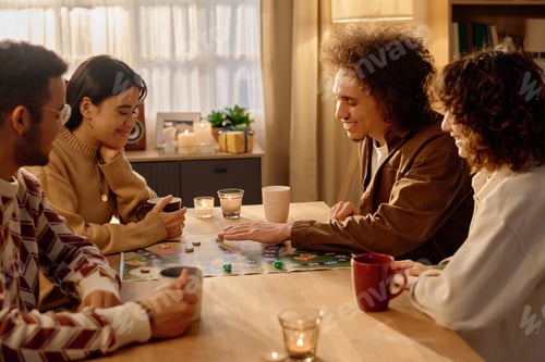 Preview: Friends Playing Board Game at Home