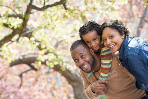 Preview: Family Smiles in the Park During Springtime