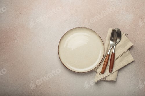 Preview: Empty plate, linen napkin and cutlery on neutral background top view