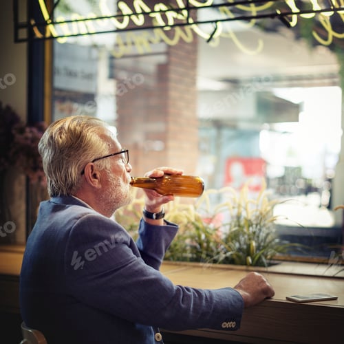 Preview: Elderly man is sitting in a pub