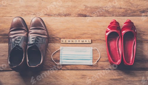 Preview: Men and women shoes laid on wooden floors, concept new normal during the epidemic disease covid-19